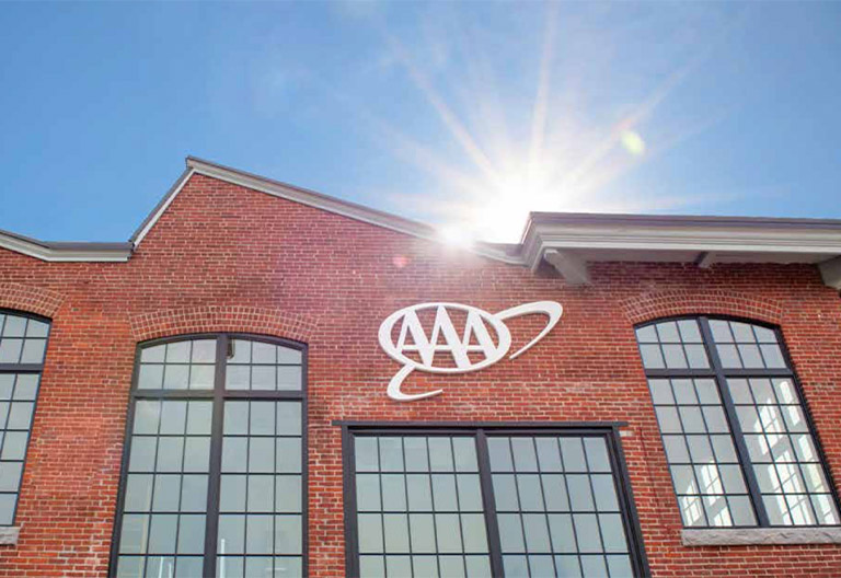 Brick building with the AAA logo.