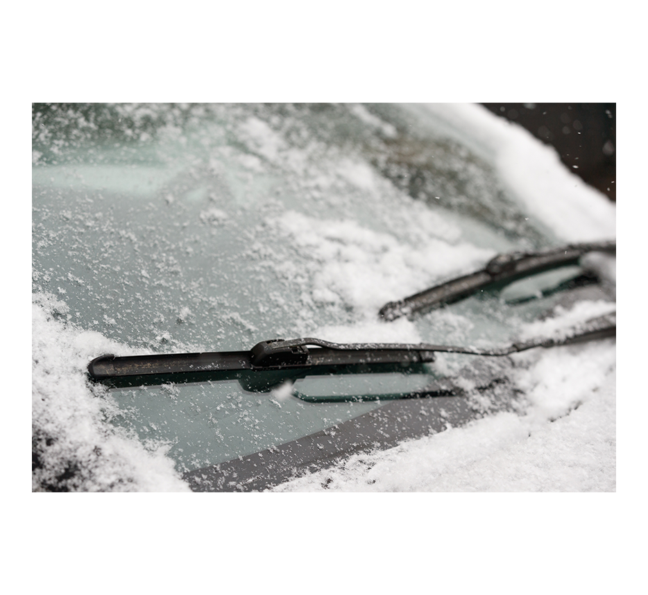 image of car with snowy windshield wipers
