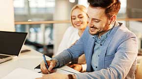 Man signing a loan.