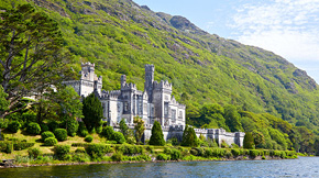 A castle along a river in Ireland. 