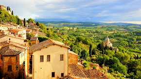 brown houses nestled in a lush green european countryside