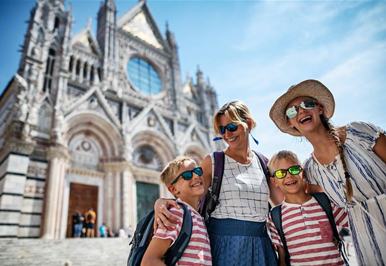 A family walking smiling traveling.