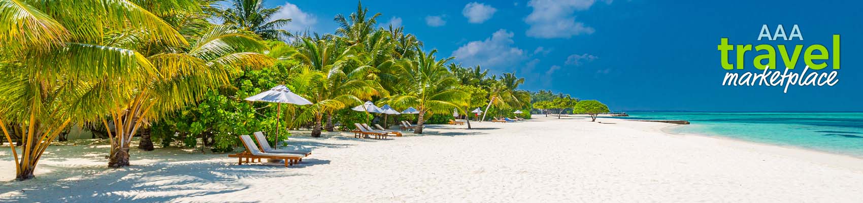 AAA Travel Marketplace. Chairs under umbrellas along the shoreline of a tropical beach. 